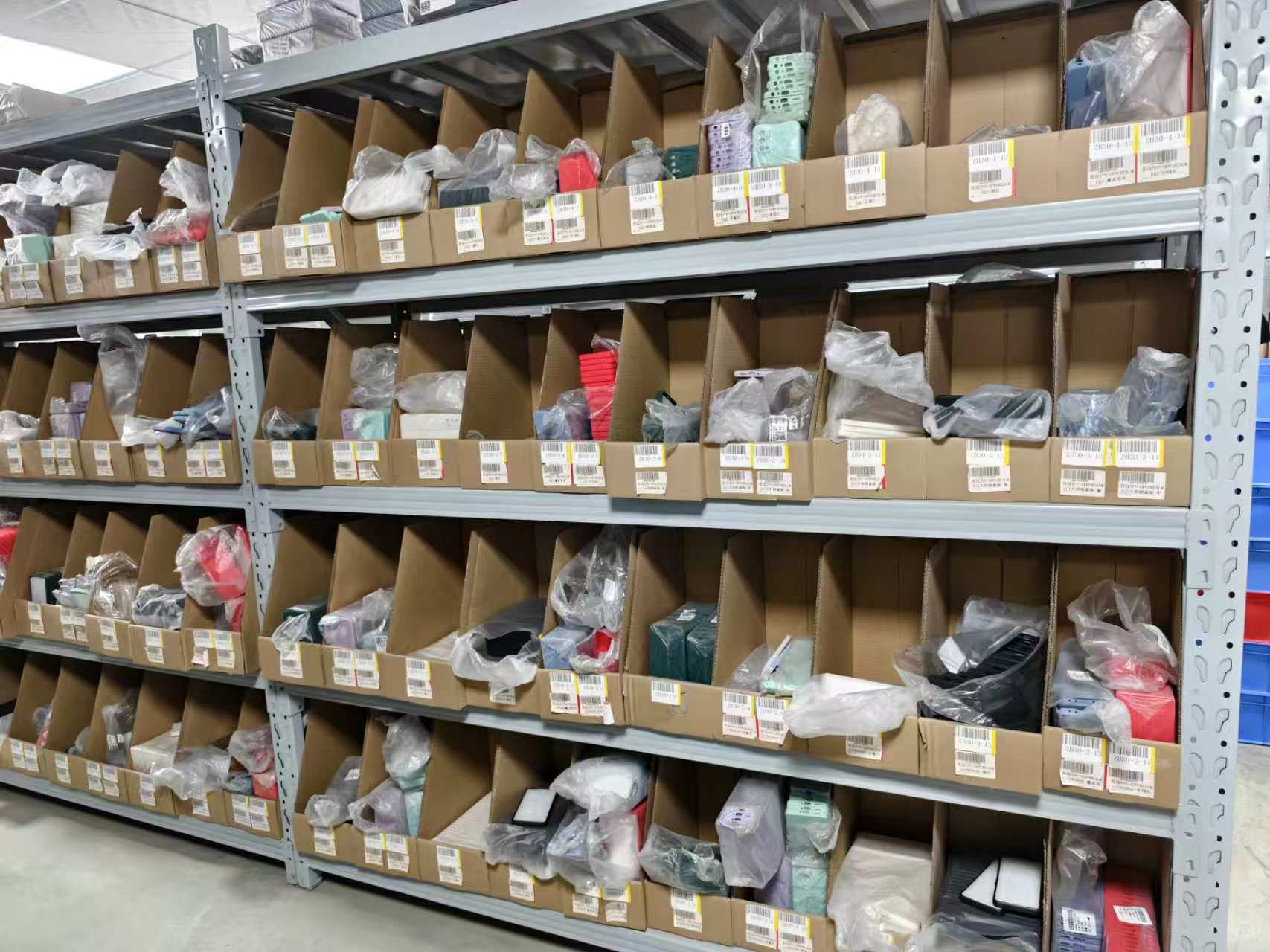 Labeled phone case storage compartments at the Chino location